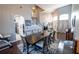 Spacious dining room open to the foyer and kitchen, features tall ceilings and staircase at 14415 Estrella Dr, Orlando, FL 32837