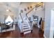 Welcoming foyer featuring staircase, hardwood floors, dining room, and providing an inviting entry at 14415 Estrella Dr, Orlando, FL 32837