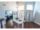 Open foyer with dark wood floors, soaring ceilings, decorative chandelier, and neutral paint at 14415 Estrella Dr, Orlando, FL 32837