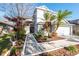 Inviting front walkway with landscaping leading to the front door of this charming two-story home at 14415 Estrella Dr, Orlando, FL 32837