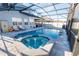 Inviting screened-in pool and spa area offers a relaxing outdoor retreat and enhances the home's appeal at 14415 Estrella Dr, Orlando, FL 32837