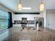 Kitchen with granite counters, stainless steel appliances and dark blue accent wall at 16133 Pebble Bluff Loop, Winter Garden, FL 34787