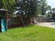 Backyard featuring a play set, a swing, and a green lawn, perfect for outdoor activities at 1721 Cheyenne Trl, Maitland, FL 32751