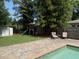 Spacious backyard with a play set and a pool, perfect for outdoor fun and relaxation at 1721 Cheyenne Trl, Maitland, FL 32751