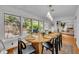 Warm dining room with hardwood floors, pendant lights and view to the backyard at 1721 Cheyenne Trl, Maitland, FL 32751