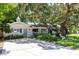 Charming single-story home with mature trees and a well-manicured lawn at 1721 Cheyenne Trl, Maitland, FL 32751
