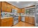 Close up of the kitchen with stainless steel appliances and granite countertops at 1721 Cheyenne Trl, Maitland, FL 32751