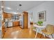 Well-lit kitchen featuring stainless steel appliances, wood cabinets and adjacent breakfast nook at 1721 Cheyenne Trl, Maitland, FL 32751