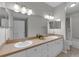 Bathroom with double sink vanity and large mirror at 193 Longview Ave # 104, Kissimmee, FL 34747