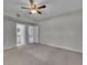 Large bedroom with a view into the bathroom and living area at 193 Longview Ave # 104, Kissimmee, FL 34747