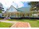 Charming clubhouse with inviting front porch and well-maintained landscaping at 193 Longview Ave # 104, Kissimmee, FL 34747