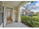 Inviting front porch with a well-maintained garden and a view of a quiet neighborhood at 193 Longview Ave # 104, Kissimmee, FL 34747