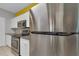 Modern kitchen featuring stainless steel appliances, white cabinetry, and stone countertops at 193 Longview Ave # 104, Kissimmee, FL 34747