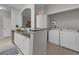 Convenient laundry area adjacent to the kitchen featuring a washer, dryer, and storage space at 193 Longview Ave # 104, Kissimmee, FL 34747
