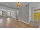Bright living room boasts wood floors, natural light, and modern ceiling fan at 193 Longview Ave # 104, Kissimmee, FL 34747