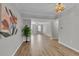 Spacious living room featuring hardwood floors and neutral gray walls at 193 Longview Ave # 104, Kissimmee, FL 34747