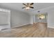 View of the open living area with hardwood floors and natural light at 193 Longview Ave # 104, Kissimmee, FL 34747
