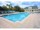 Community pool with clear water and surrounding lounge area at 193 Longview Ave # 104, Kissimmee, FL 34747