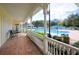 Spacious covered porch overlooking a community pool with ample seating at 193 Longview Ave # 104, Kissimmee, FL 34747