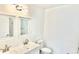 Bathroom with a double sink vanity, commode and a mirror view of the shower and tub combination at 20660 Se 155Th St, Umatilla, FL 32784