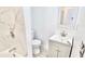 Bathroom with a single sink vanity, commode and tiled shower and tub combination at 20660 Se 155Th St, Umatilla, FL 32784