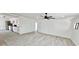 Open concept living area with new flooring and modern ceiling fan at 20660 Se 155Th St, Umatilla, FL 32784