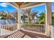 Balcony with views of mature landscaping and lake at 2118 Lake Dr, Winter Park, FL 32789