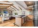 Wet bar area with wood beam ceilings, granite countertops, and bar seating for entertaining at 2118 Lake Dr, Winter Park, FL 32789