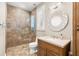 Bathroom with a glass door shower, decorative mirror, and stylish fixtures at 2118 Lake Dr, Winter Park, FL 32789