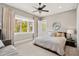 Comfortable bedroom with neutral tones, bright natural light and modern ceiling fan at 2118 Lake Dr, Winter Park, FL 32789