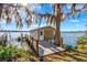 Charming boat house on a wooden pier with access to the tranquil lake waters at 2118 Lake Dr, Winter Park, FL 32789
