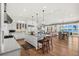 Open-concept kitchen featuring a large island, stainless steel appliances, and hardwood floors at 2118 Lake Dr, Winter Park, FL 32789