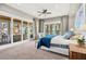 This main bedroom offers access to a private balcony with great views of the water at 2118 Lake Dr, Winter Park, FL 32789