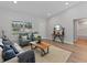 Bright and inviting living room featuring two blue armchairs and a wood coffee table on a jute rug at 2220 Sw 169Th Pl, Ocala, FL 34473