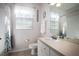 Bright bathroom featuring a vanity and shower-tub combo with modern fixtures at 2304 Silver Palm Dr # 103, Kissimmee, FL 34747