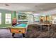 Spacious game room featuring a pool table, ping pong, and token machine for hours of entertainment and recreation at 2304 Silver Palm Dr # 103, Kissimmee, FL 34747