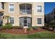 Cozy patio with screened enclosure, stylish seating, and lush landscaping for privacy at 2304 Silver Palm Dr # 103, Kissimmee, FL 34747