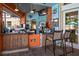 Charming poolside bar area with bamboo accents, seating, and a television at 2304 Silver Palm Dr # 103, Kissimmee, FL 34747