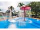 Interactive splash pad with vibrant colors and playful water features, perfect for Gathering fun and relaxation at 2304 Silver Palm Dr # 103, Kissimmee, FL 34747