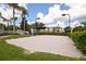 Outdoor sand volleyball court surrounded by green landscaping at 2304 Silver Palm Dr # 103, Kissimmee, FL 34747