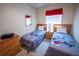 Cozy bedroom features two twin beds with themed bedding and a wooden dresser at 2412 Caravelle Cir, Kissimmee, FL 34746