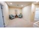 Carpeted Bonus Room with two comfortable chairs at 2412 Caravelle Cir, Kissimmee, FL 34746