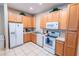 Efficient kitchen featuring ample cabinetry and white appliances, offering functionality and style at 2412 Caravelle Cir, Kissimmee, FL 34746