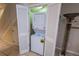 Convenient laundry closet with stacked washer and dryer, maximizing space and efficiency at 2412 Caravelle Cir, Kissimmee, FL 34746