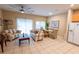Spacious living room with tiled floors and neutral decor, perfect for relaxing and entertaining at 2412 Caravelle Cir, Kissimmee, FL 34746