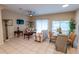 Open-concept living room with a ceiling fan and neutral decor, creating a comfortable gathering space at 2412 Caravelle Cir, Kissimmee, FL 34746