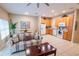 Spacious living area with an open layout that combines the kitchen, dining, and living spaces at 2412 Caravelle Cir, Kissimmee, FL 34746