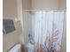 Clean shower area includes a towel rack and shower curtain at 2412 Caravelle Cir, Kissimmee, FL 34746