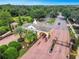 Aerial view of Providence community entrance, showcasing its well-manicured landscaping and gated entry at 2442 Heritage Green Ave, Davenport, FL 33837