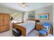 Cozy bedroom with a large window and a soft color palette at 2442 Heritage Green Ave, Davenport, FL 33837
